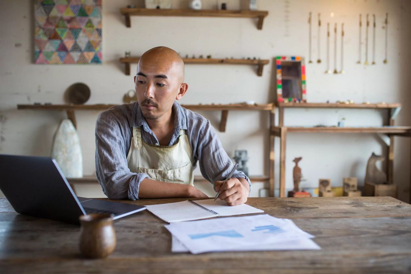 Bookkeeper organizing financial records and receipts on a desk