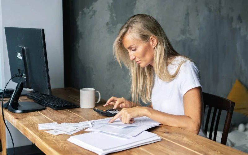 Bookkeeper at a desk settling bills and managing business finances
